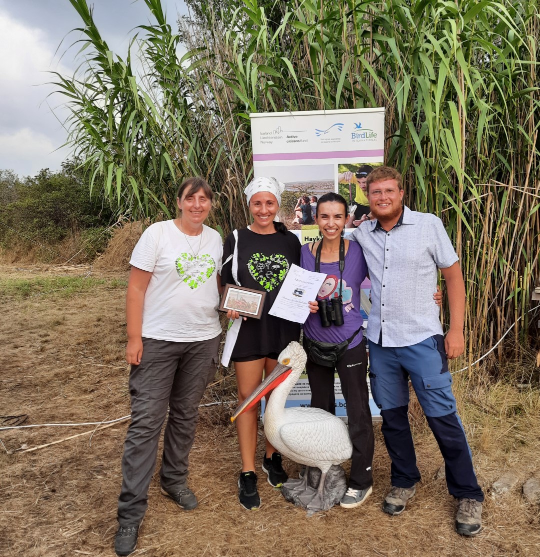 a group of people with a plastic pelican